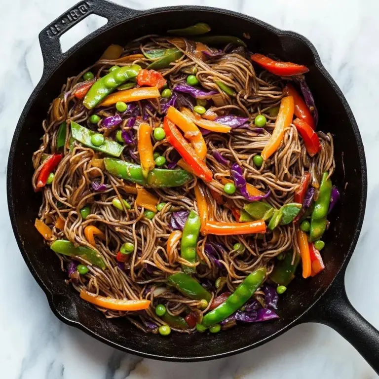 A colorful bowl of Vegetable Teriyaki Stir-Fry with Noodles garnished with sesame seeds.